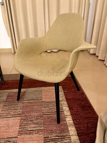 Beige Modern Accent Chair with Curved Back and Black Legs