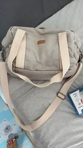 Neutral beige diaper changing bag with shoulder strap