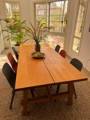 Solid wood dining table in light oak finish - excellent condition