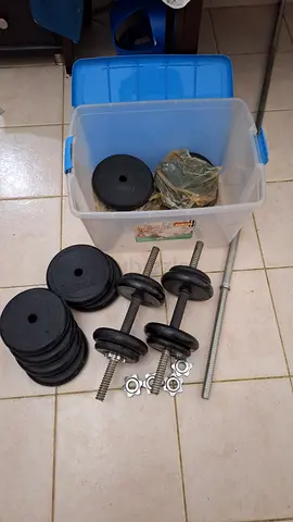 Adjustable dumbbell set with weight plates and bars - used