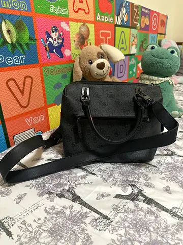GUESS small black monogram Sling  Bag with floral charm