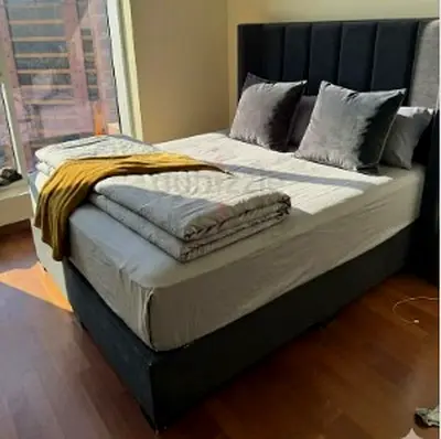 Grey upholstered bed frame with padded headboard - King size
