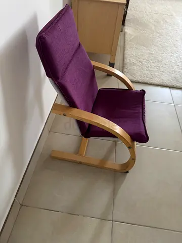 Modern wooden lounge chair with purple cushion - good condition for kids