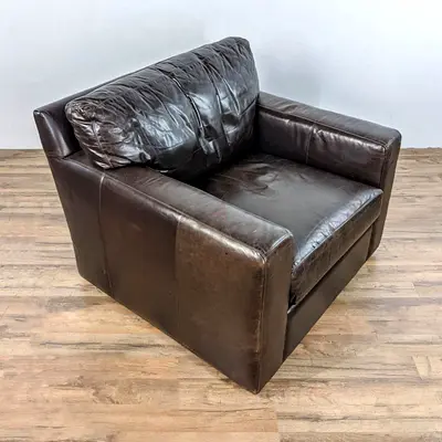 Crate and Barrel Axis natural leather Swivel single seat sofa