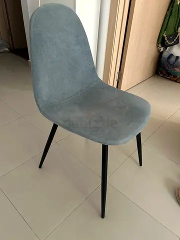 Grey upholstered dining/desk chair with black metal legs