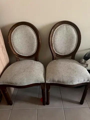 Pair of vintage-style wooden dining chairs with grey upholstery