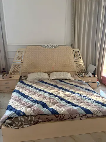 Bed frame with mattress and side drawers