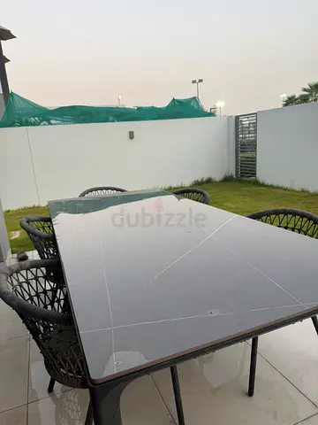 Modern Outdoor Dining Set with Grey Stone Top Table and Woven Chairs