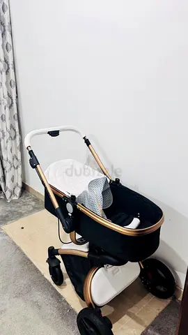 Elegant black and gold bassinet stroller - good condition