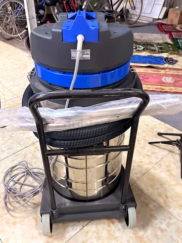 Industrial wet/dry vacuum cleaner — stainless steel, heavy-duty, on wheels