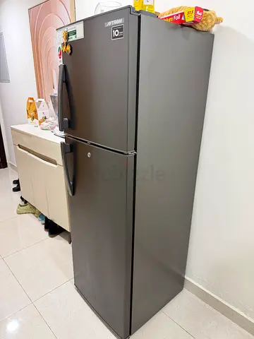 Used double-door refrigerator in good condition (top freezer)
