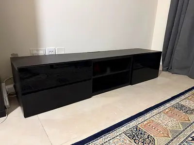 Low black TV cabinet with storage shelves - excellent condition