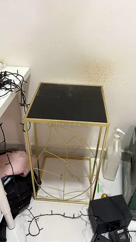Gold Metal Console Table with Black Glass Top - Decorative Leaf Design