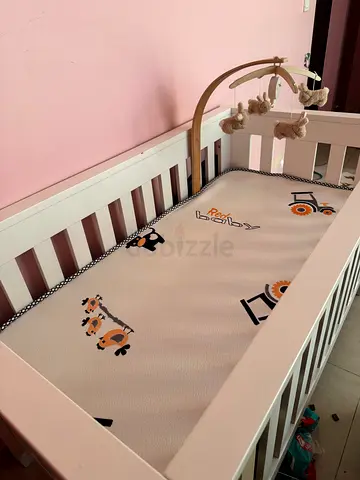 White baby crib with mattress and plush mobile - good condition