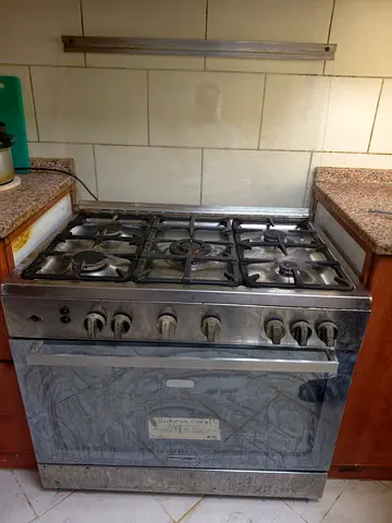 Used stainless steel 5-burner gas range with oven - working condition