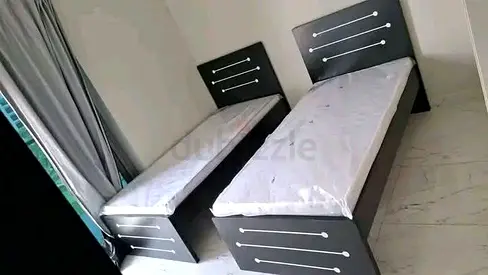 Two Single Wooden Beds with Mattresses - New
