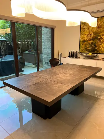 Modern rectangular dining table with stone-look top