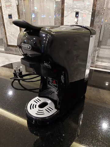 Single-Serve Capsule Coffee Maker — Compact and Working Well . Only 3 time uses for 3 cup coffee .