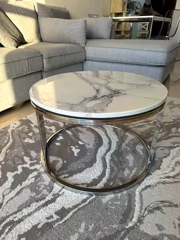 Small round marble-effect coffee table with chrome frame