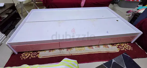 White wooden storage bed base with under-drawers - single/guest, also one wooden IKEA single bed.