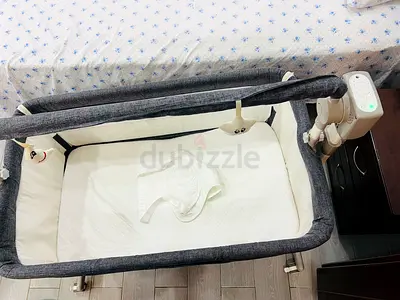 Portable bedside electric bassinet with 5 speed swing, music , remote control and canopy - grey