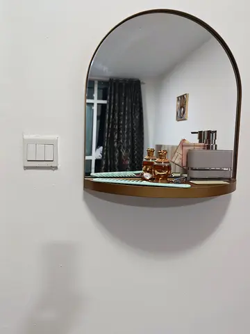 Wall-mounted arched mirror with small shelf - gold frame