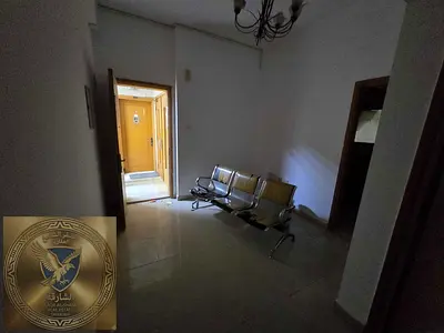 One bedroom and living room in Al Majaz with balcony builtin wardrobes central AC good space in prime location