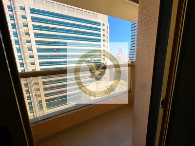 Open view 2-bedroom apartment with a large living room and balcony, featuring a big kitchen and a w
