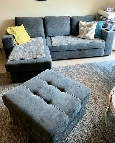 Grey custom made L-shaped Fabric Sofa with sofa bed, storage and with Ottoman - Great Condition