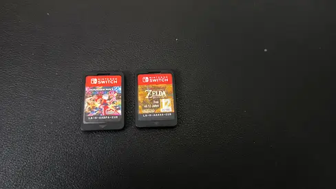 Nintendo Switch game cartridges (no case) - Mario Kart 8 Deluxe  Zelda: Breath of the Wild.
