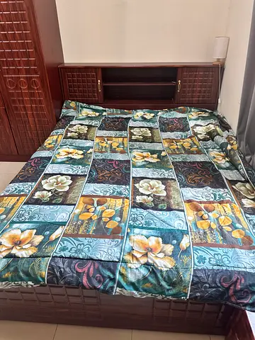 Queen bed with wooden headboard and 2 side table