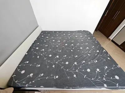 Modern White Bed Frame with Floral Patterned Mattress