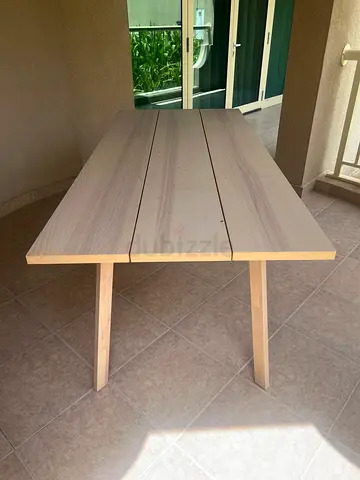 Simple wooden dining table - light finish, very good condition