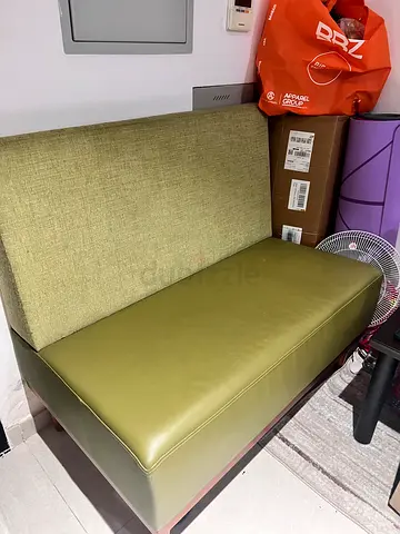 Compact 2-seater olive green sofa — good perfect condition.