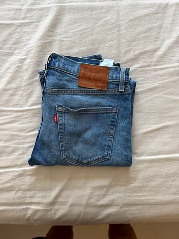 Levis Blue Denim Jeans - Good Condition, Size Noted on Tag
