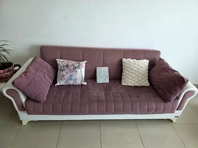 Light mauve 3-seater sofa bed with cushions - good condition
