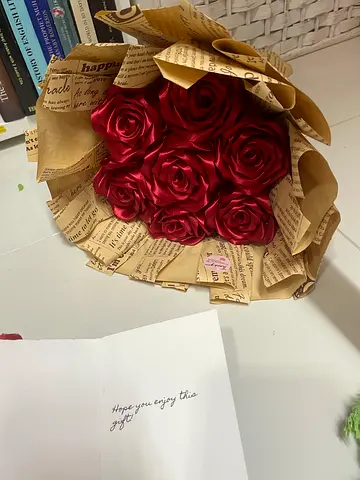 Decorative bouquet of red artificial roses (handmade) with vintage paper wrapping
