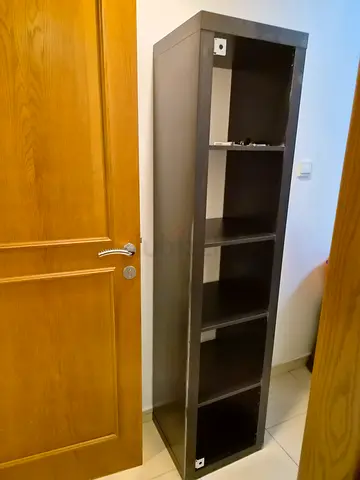 Wall-mounted black shelving unit with 4 compartments