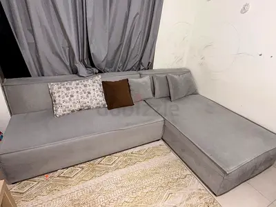Grey L-Shaped Sectional Sofa with Cushions