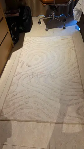 Light cream modern abstract rug - good condition.