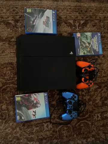 PS4 with controller and games for sale