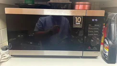 Relocating. Samsung 25L Microwave with Grill - Good Condition, 10-Year Warranty Sticker