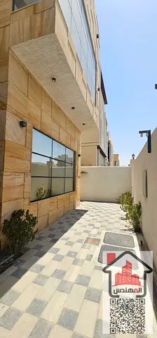 Villa for sale in Ajman, Al Yasmin area, with air conditioning, water, and electricity. It consists