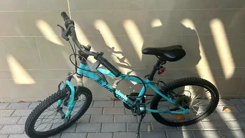 Used turquoise 20-inch mountain bike - good condition