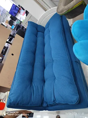 Blue tufted 2-seater sofa / futon - good condition