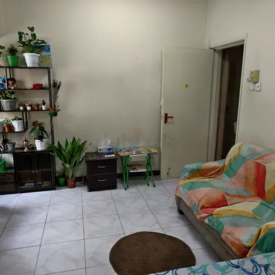 Family sharing room available with washroom,Balcony, Building parking avail in Rola street Burdubai