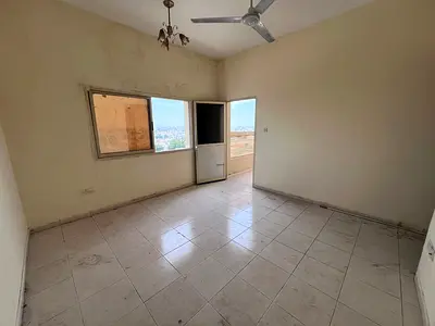 Two-bedroom apartment with a living room for rent in Al Nuaimiya 2 at a great price and in a prime location near College Street.