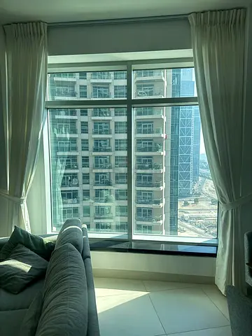 White Full-Length Curtains with Roller Blind and Rods.