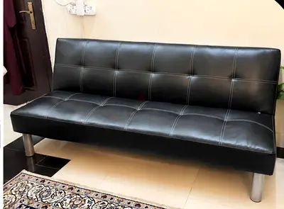 Black faux leather 3-seater sofa bed / futon