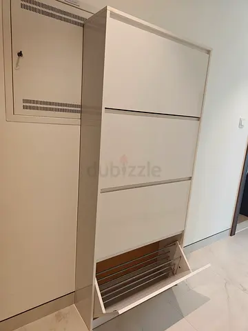 Slim White Shoe Cabinet with Three Drop-down Compartments